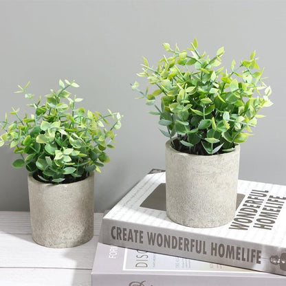 deux Plante artificielle sur un livre décoratif